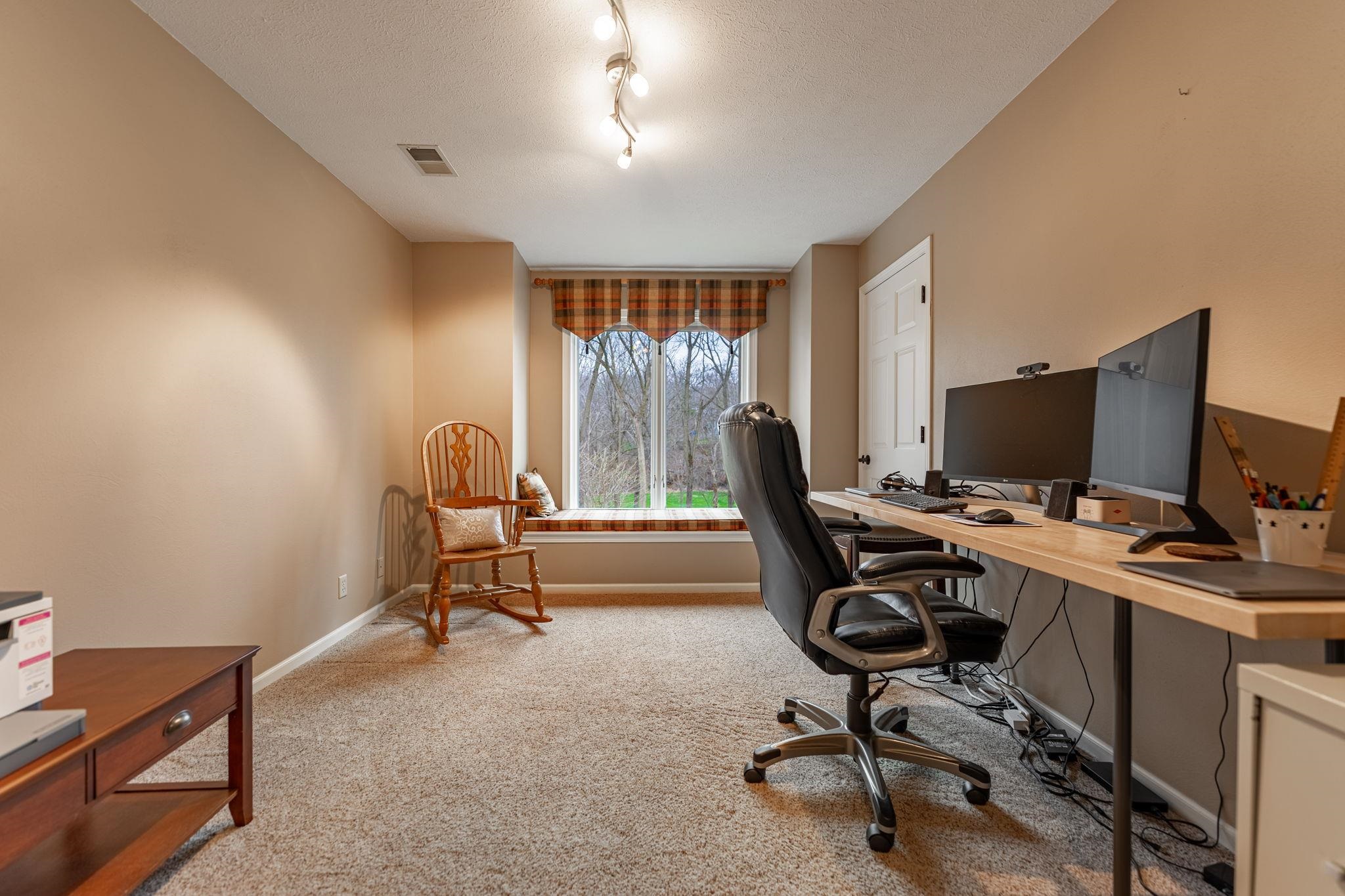 8161 Killarney Aire Road Roscoe, IL 61073 - Photo 37 of 53 a view of a workspace with furniture and a window