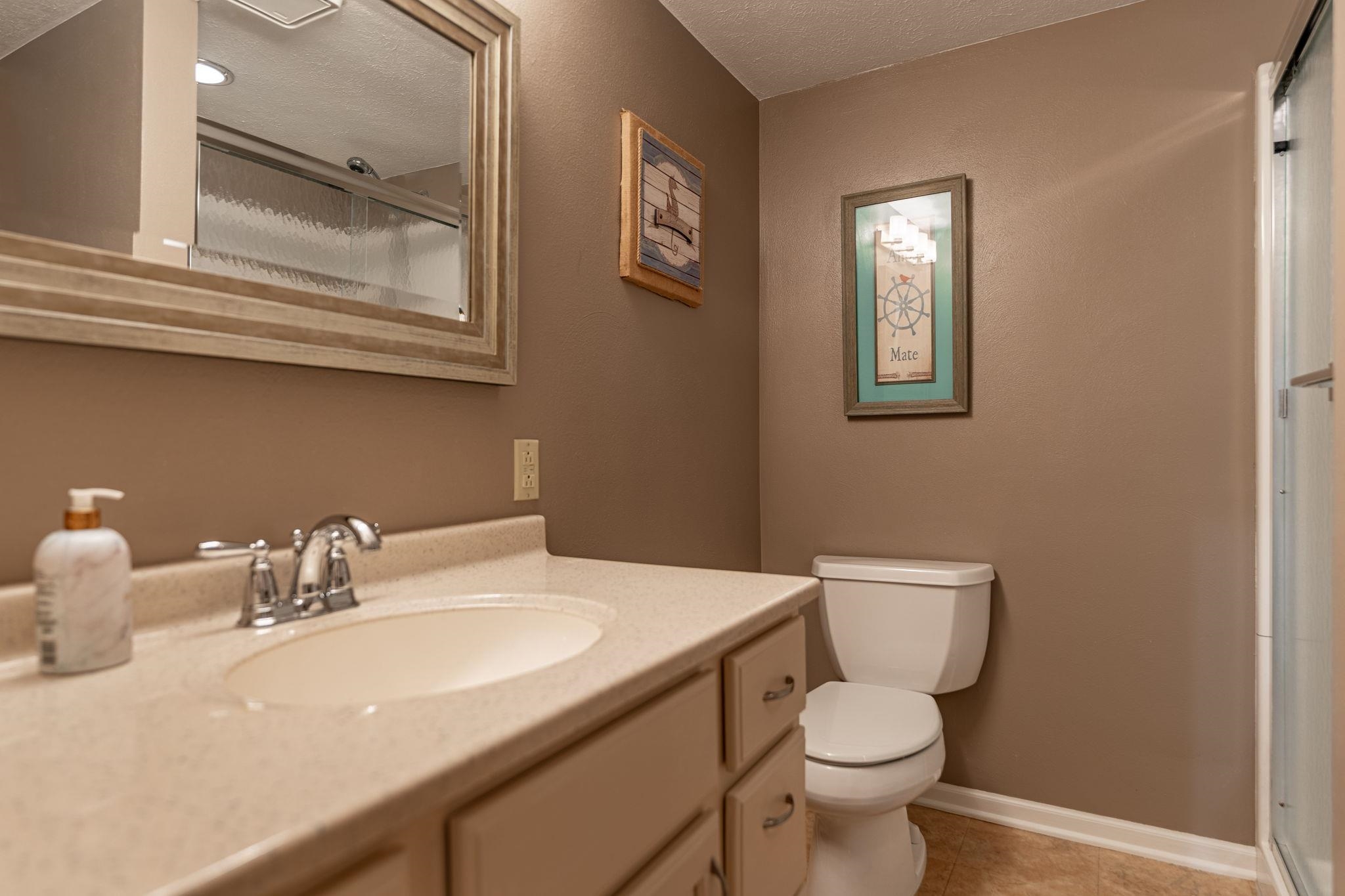 8161 Killarney Aire Road Roscoe, IL 61073 - Photo 38 of 53 a bathroom with a toilet sink and mirror