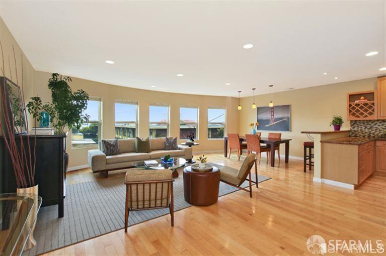 1336 18th Avenue, Unit B San Francisco, CA 94122 - Photo 2 of 8 a living room with furniture kitchen view and a large window