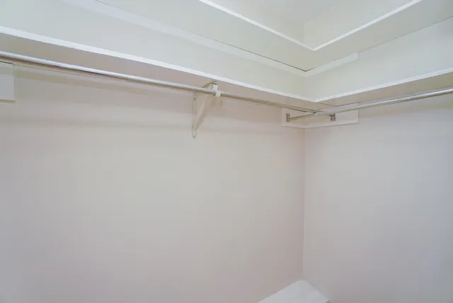 a view of a room with shelf on the wall
