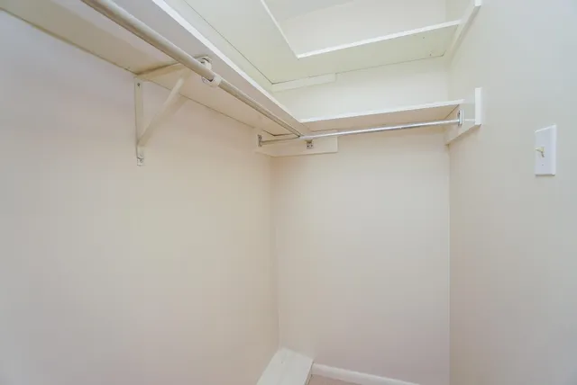 a view of an empty walk in closet