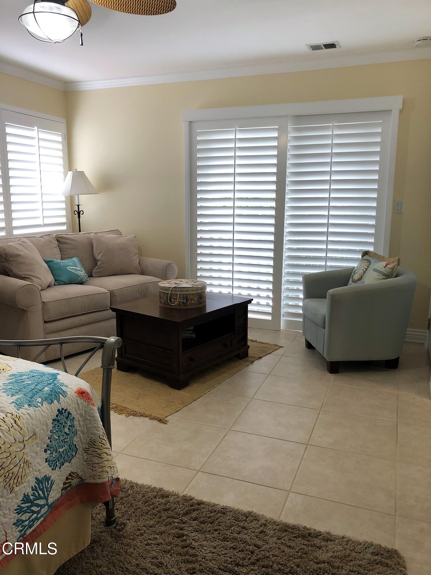 4962 Nautilus Street, Unit 1 Oxnard, CA 93035 - Photo 12 of 18 a bedroom with furniture and a window