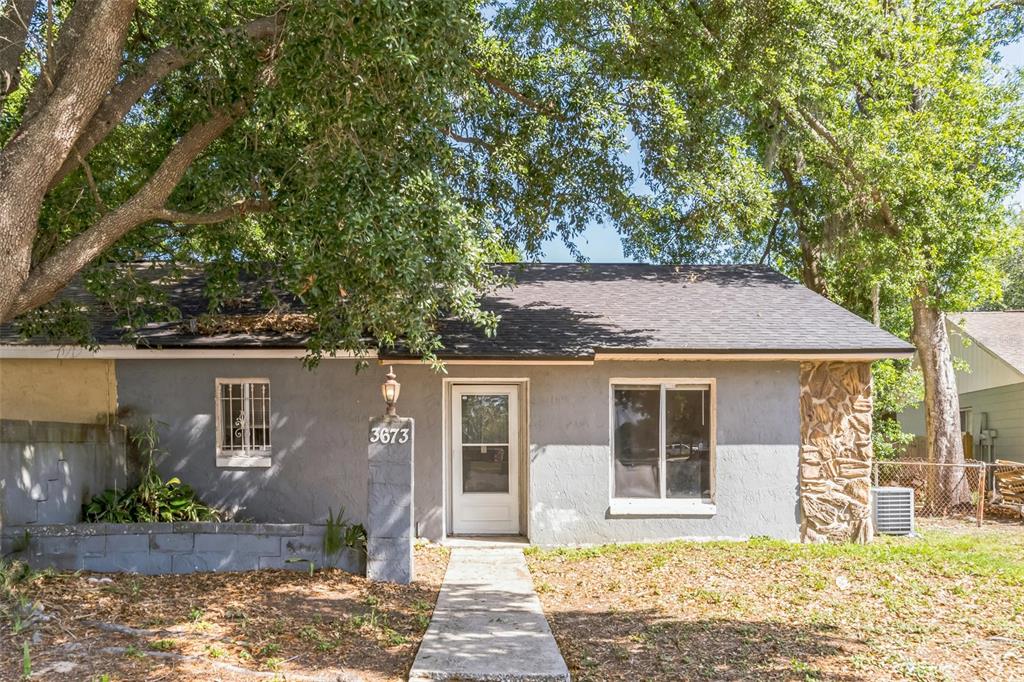 3673 Westland Court Orlando, FL 32818 - Photo 1 of 1 a front view of a house with garden