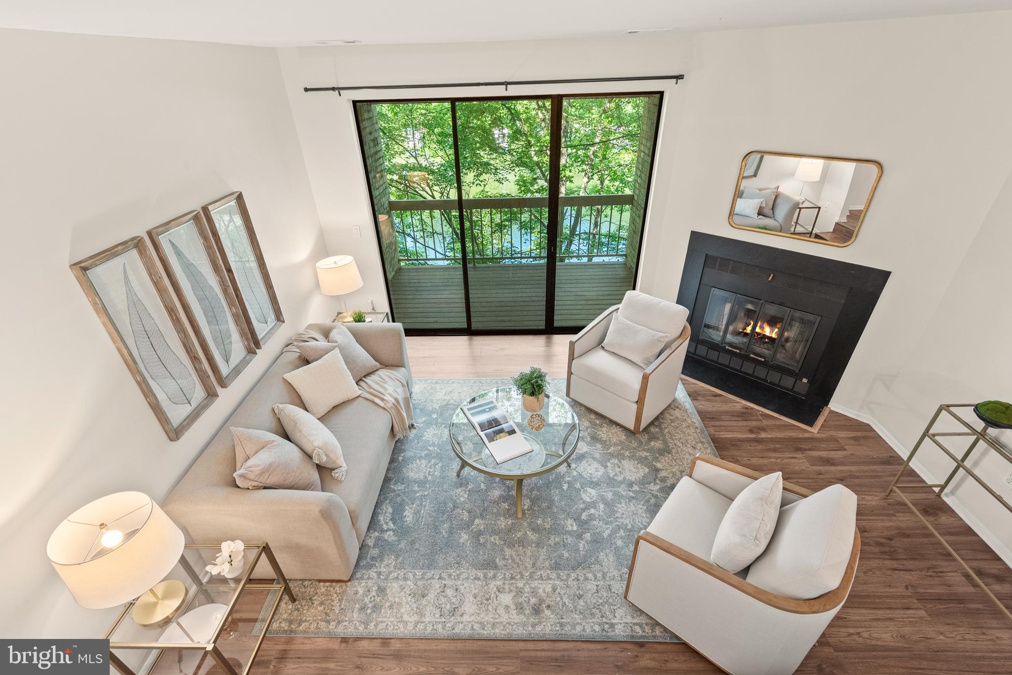 11116 Boathouse Court, Unit 93 Reston, VA 20191 - Photo 12 of 34 a living room with furniture and a floor to ceiling window