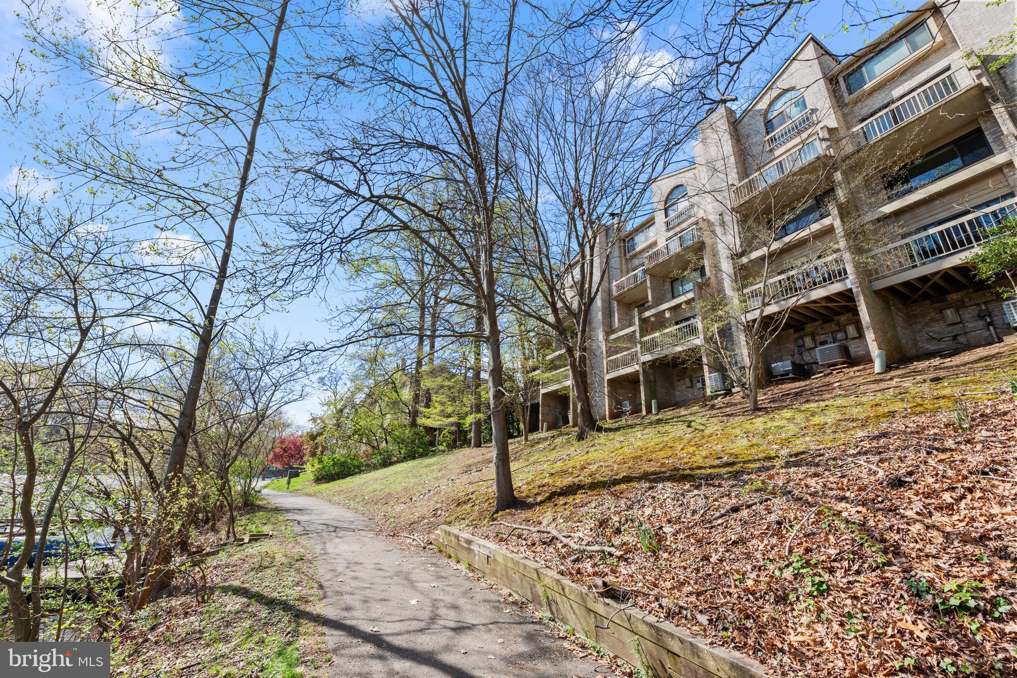 11116 Boathouse Court, Unit 93 Reston, VA 20191 - Photo 31 of 34 a view of a building with a yard