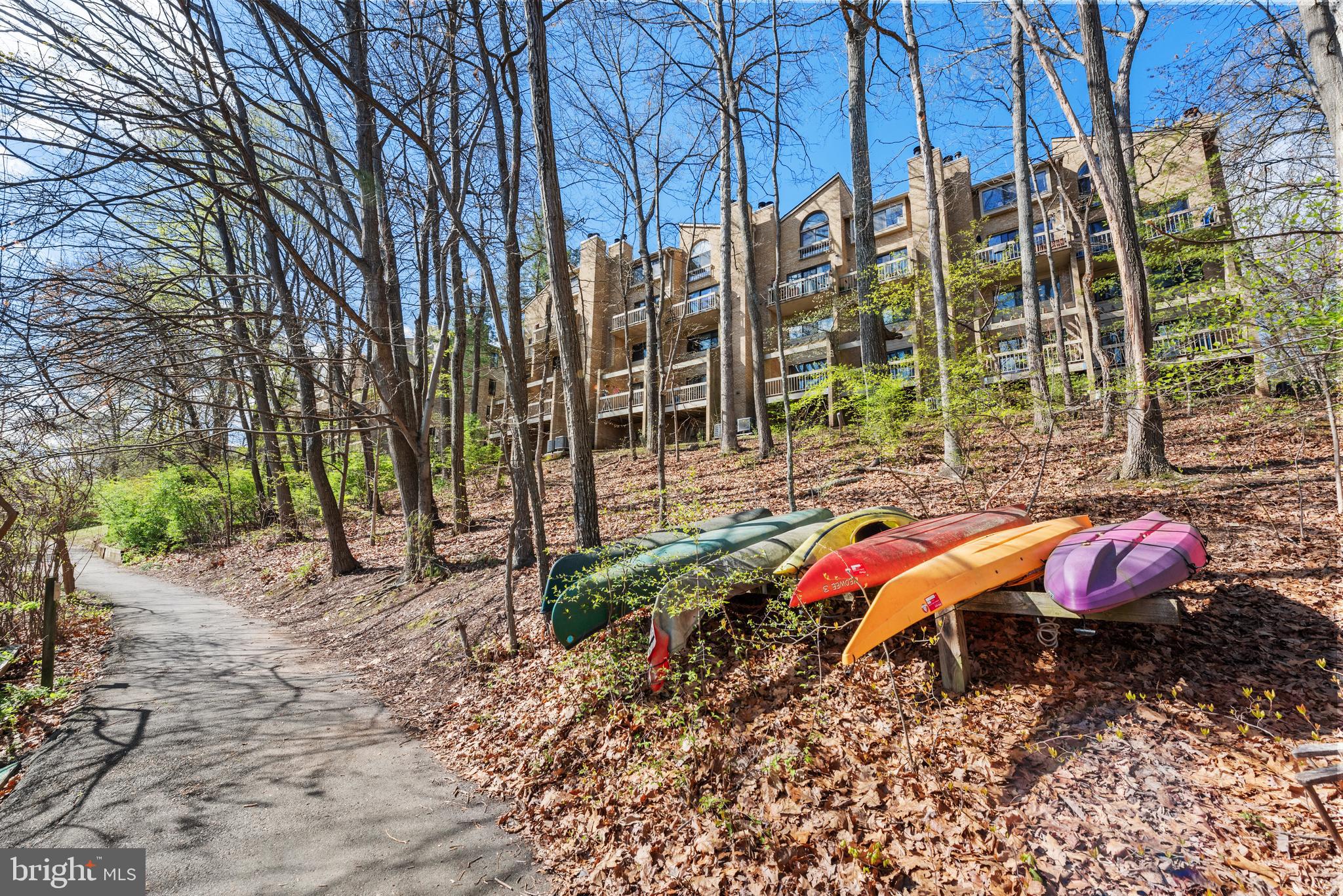 11116 Boathouse Court, Unit 93 Reston, VA 20191 - Photo 33 of 34 a view of a yard with a table and chairs under an umbrella