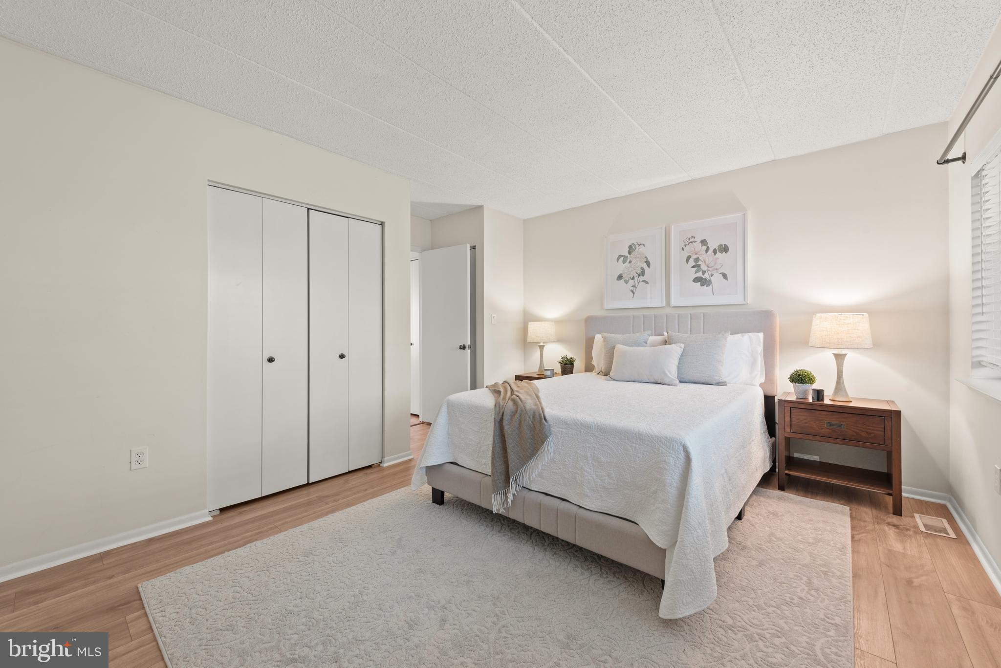 11116 Boathouse Court, Unit 93 Reston, VA 20191 - Photo 8 of 34 a bedroom with a bed and a walk in closet