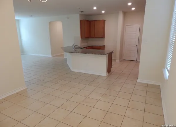 a kitchen with stainless steel appliances a refrigerator and a stove top oven