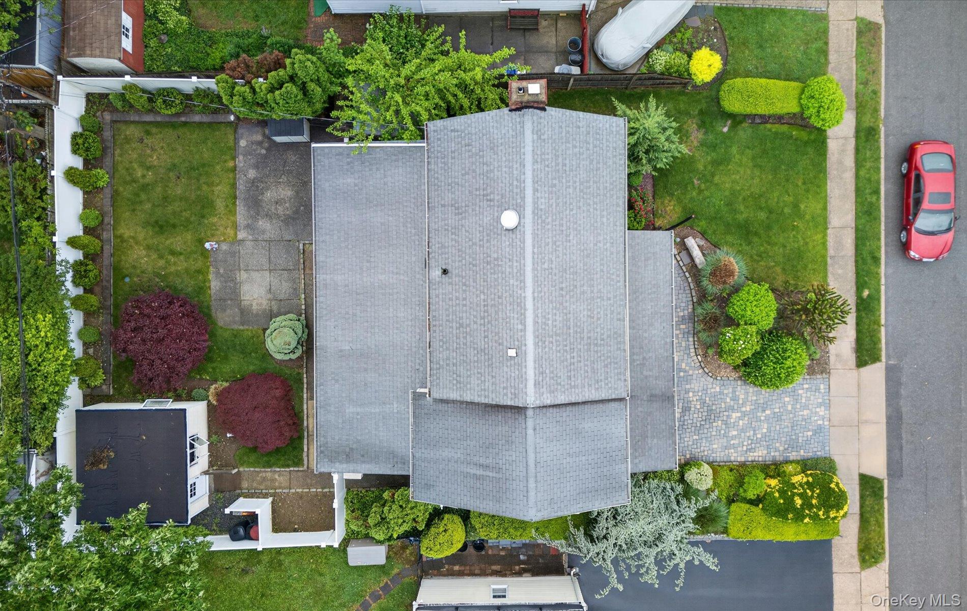 24 Purdue Road Glen Cove, NY 11542 - Photo 6 of 41 an aerial view of a house with a garden
