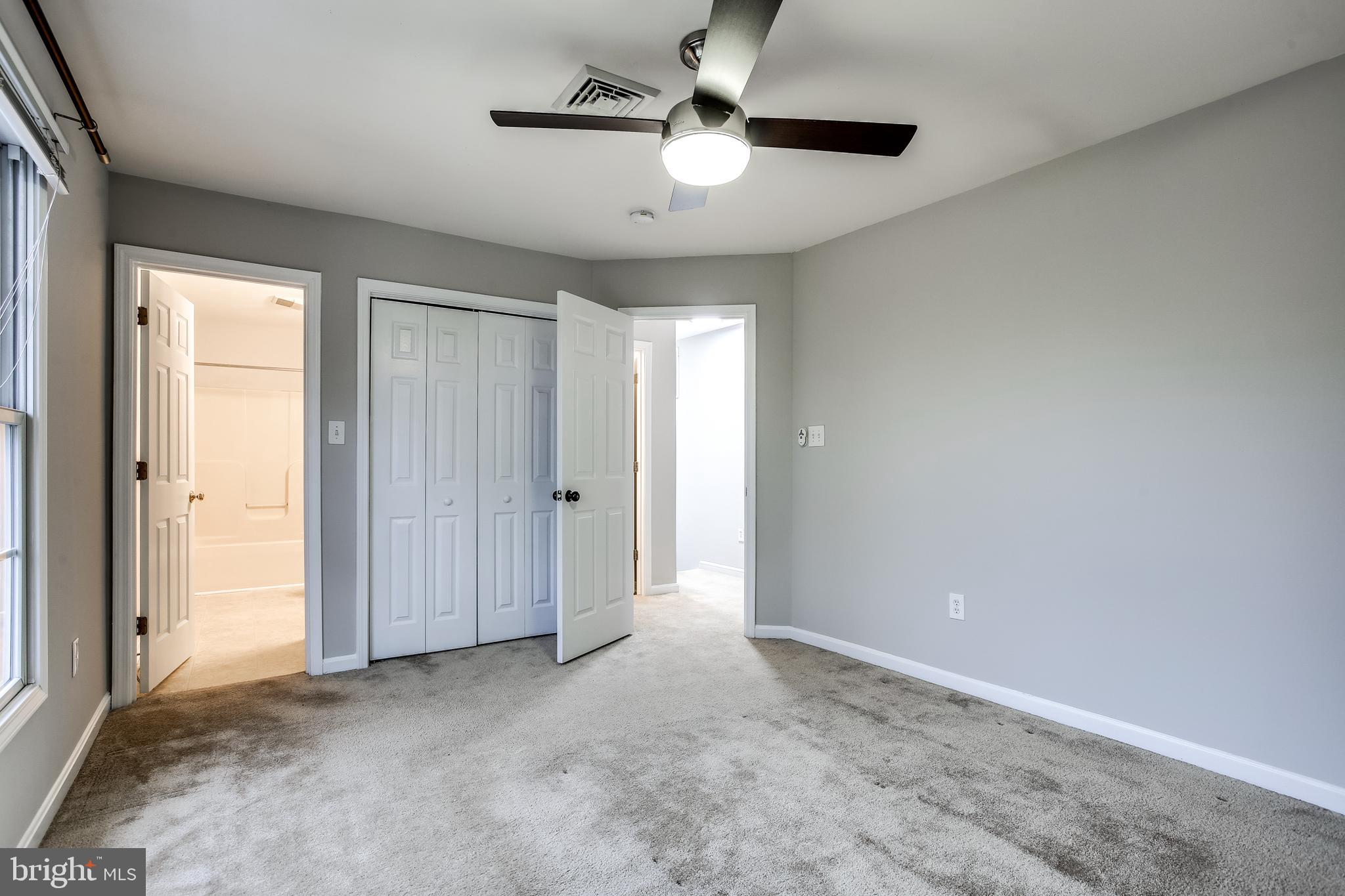 11506 Joseph Mill Road Silver Spring, MD 20906 - Photo 18 of 29 a view of an empty room and a ceiling fan