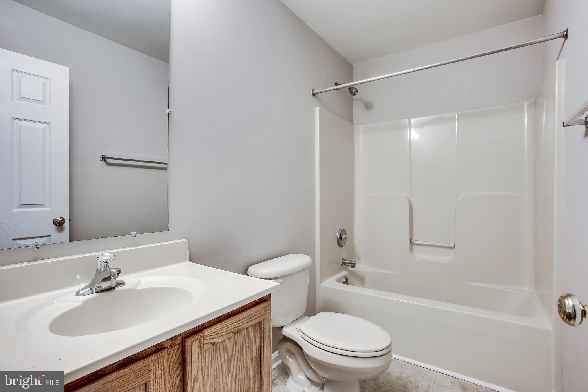 11506 Joseph Mill Road Silver Spring, MD 20906 - Photo 20 of 29 a bathroom with a sink toilet tub vanity and shower