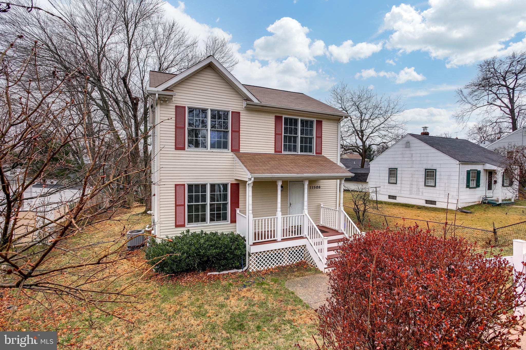 11506 Joseph Mill Road Silver Spring, MD 20906 - Photo 2 of 29 a front view of a house with a yard and garage