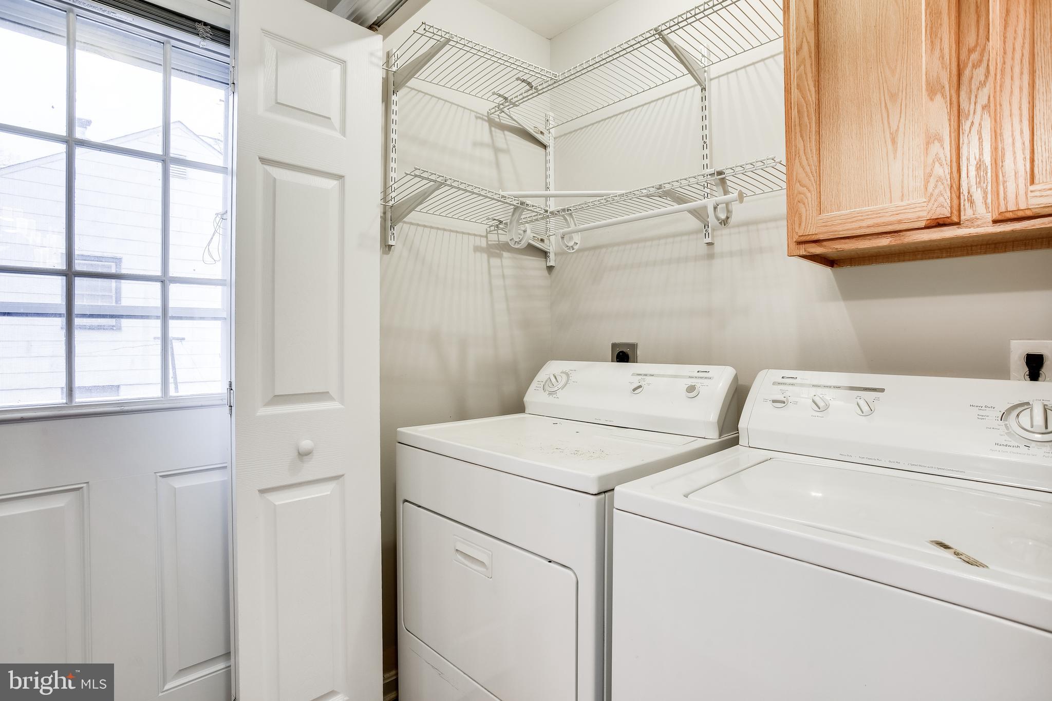 11506 Joseph Mill Road Silver Spring, MD 20906 - Photo 25 of 29 a view of storage and utility room with washer and dryer