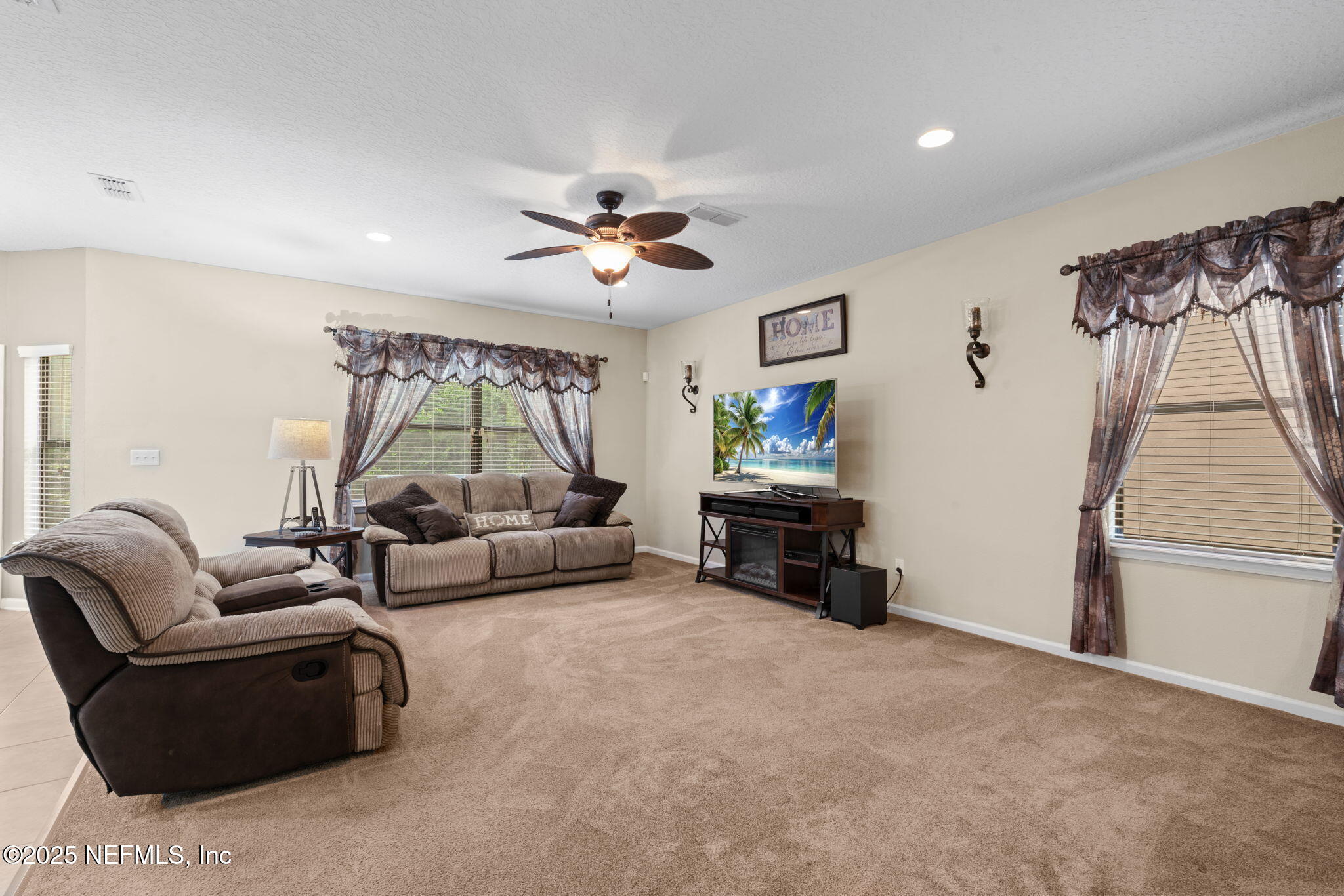 203 Buck Run Way St. Augustine, FL 32092 - Photo 15 of 62 a living room with furniture and a couch