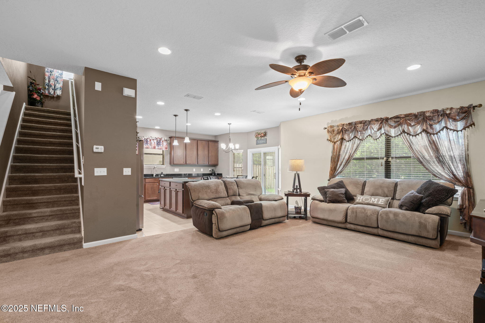 203 Buck Run Way St. Augustine, FL 32092 - Photo 16 of 62 a living room with furniture and a large window