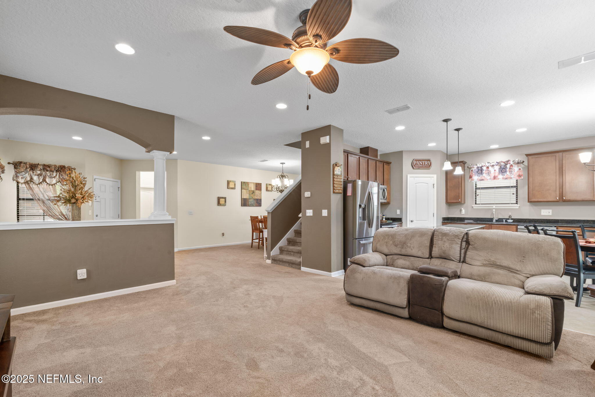 203 Buck Run Way St. Augustine, FL 32092 - Photo 17 of 62 a living room with furniture and a ceiling fan