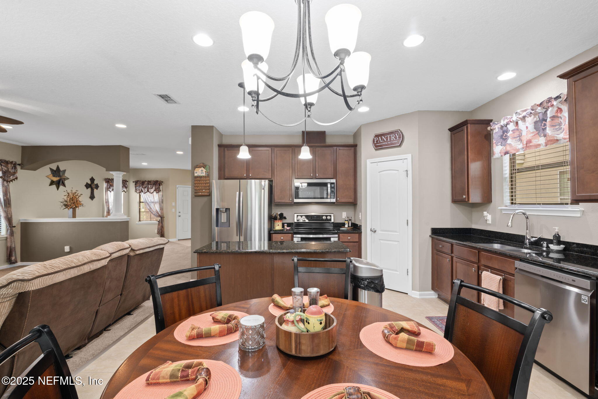 203 Buck Run Way St. Augustine, FL 32092 - Photo 20 of 62 a large kitchen with a table and chairs