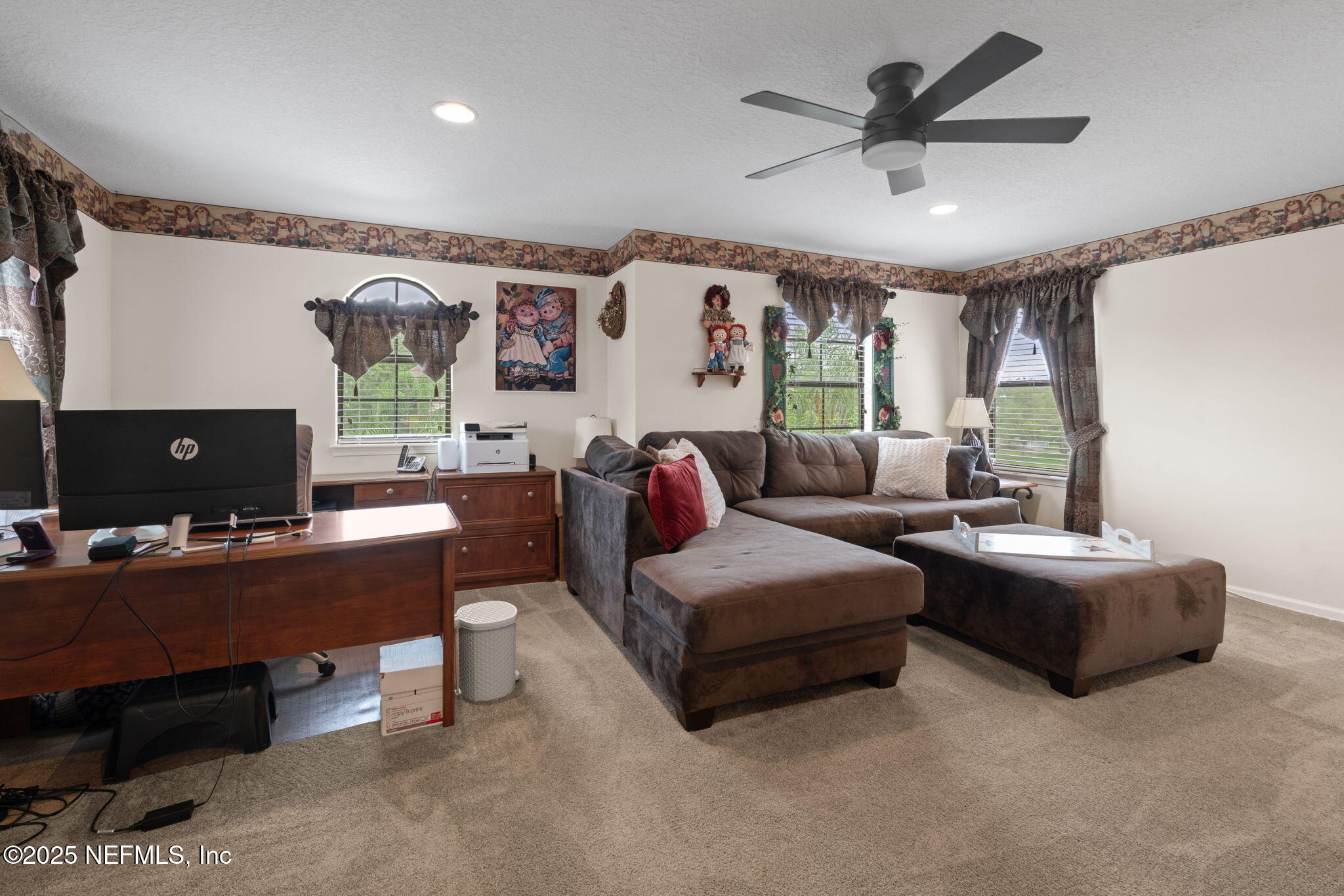 203 Buck Run Way St. Augustine, FL 32092 - Photo 37 of 62 a living room with furniture and a flat screen tv