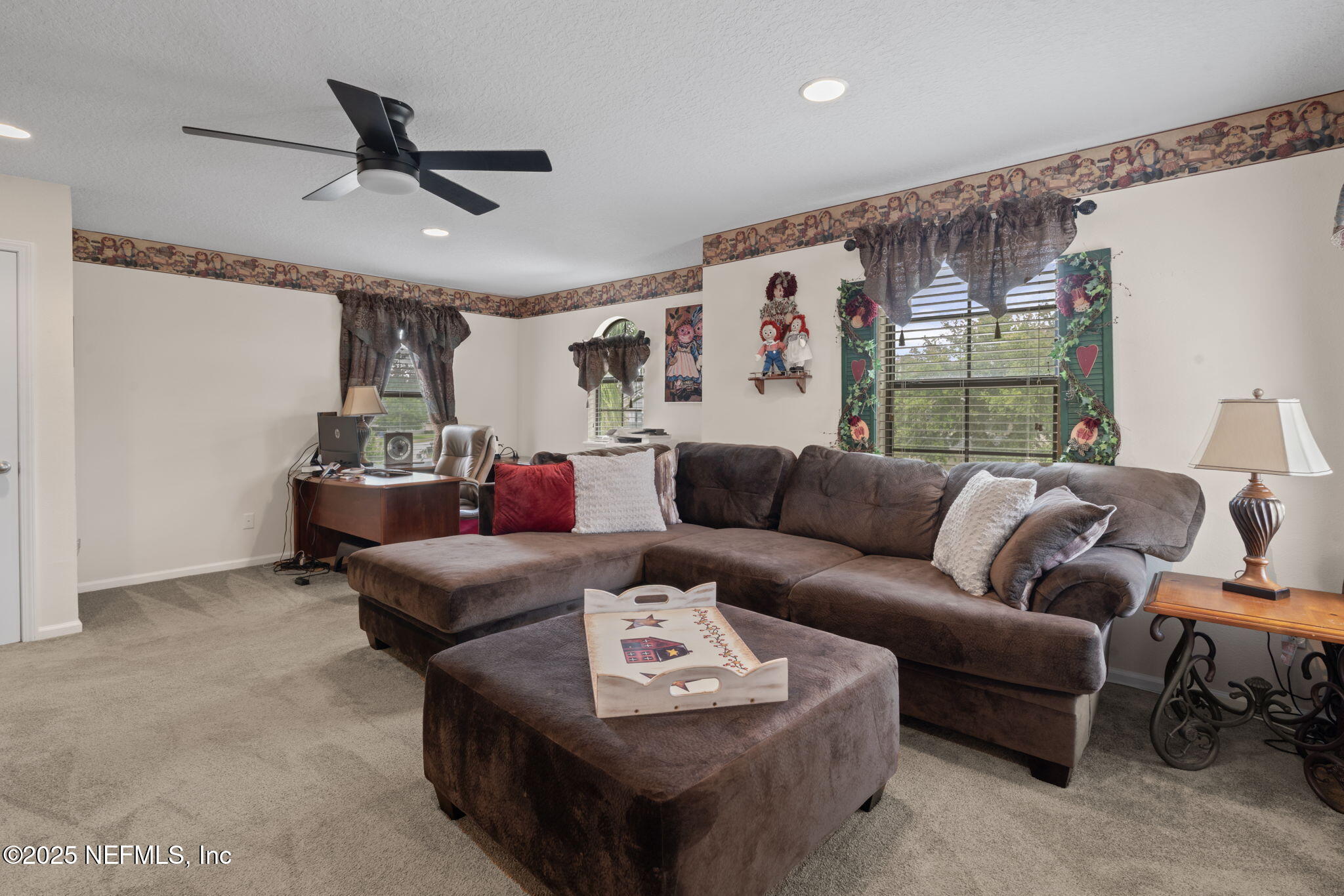 203 Buck Run Way St. Augustine, FL 32092 - Photo 38 of 62 a living room with furniture and a ceiling fan