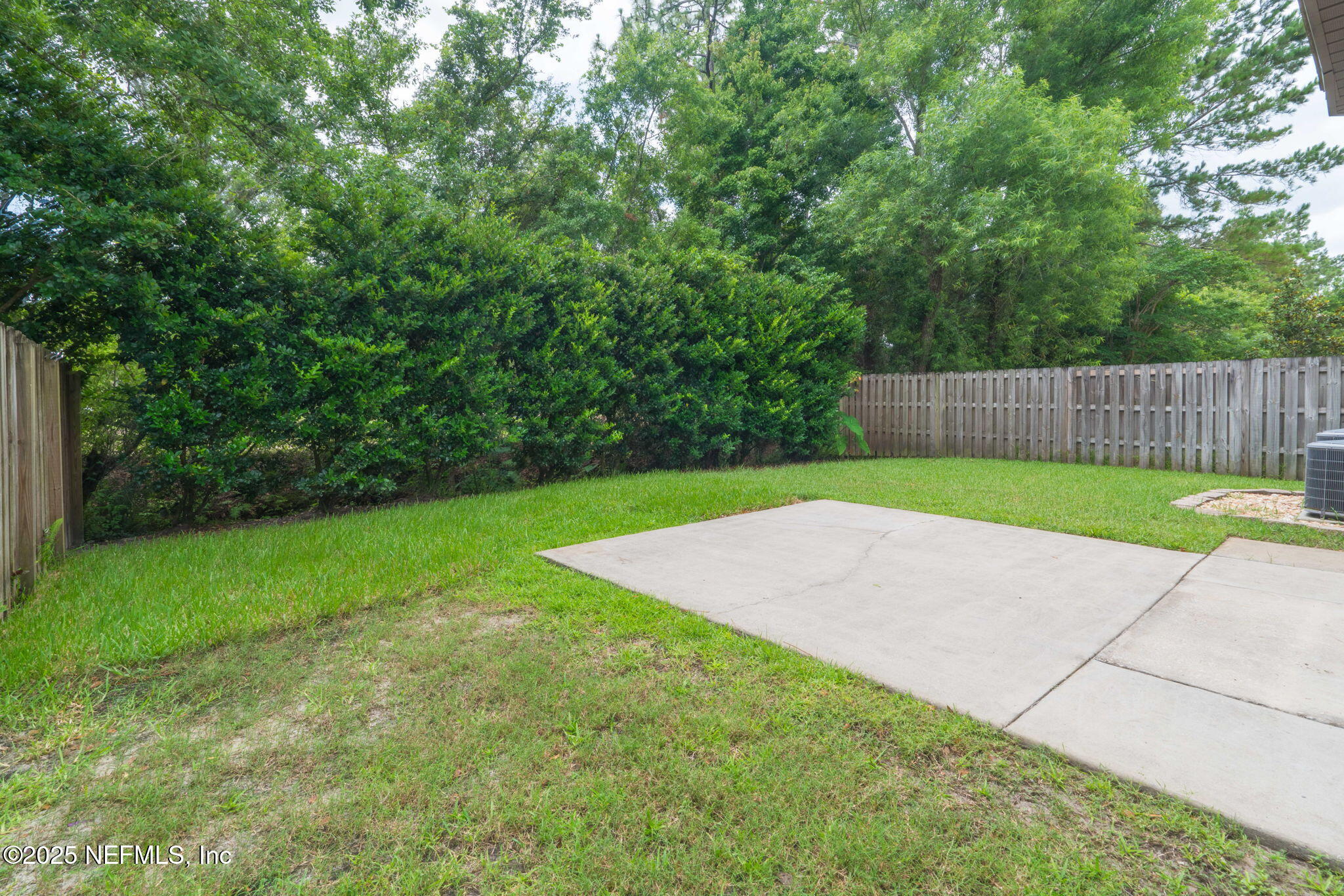 203 Buck Run Way St. Augustine, FL 32092 - Photo 43 of 62 a view of a backyard with a small cabin