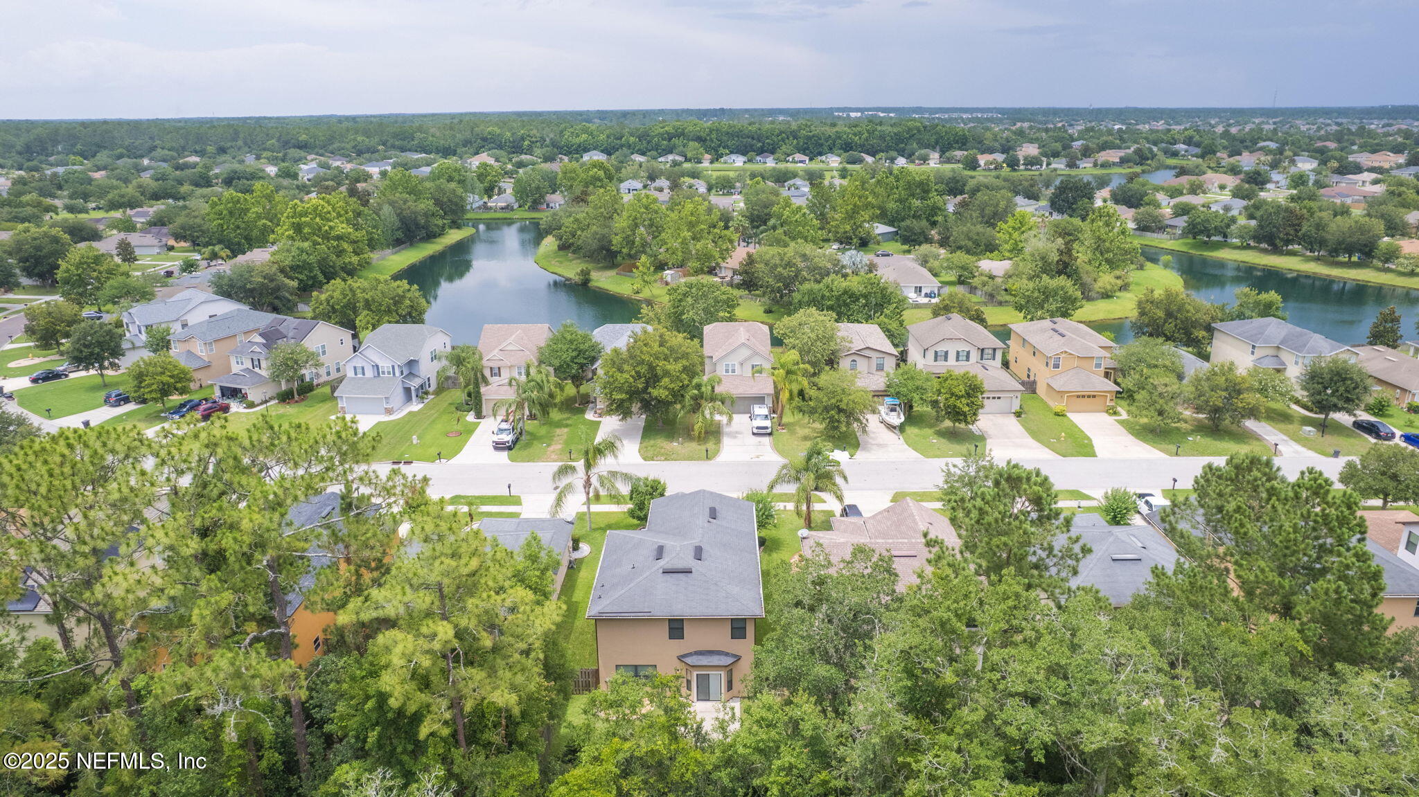 203 Buck Run Way St. Augustine, FL 32092 - Photo 52 of 62 an aerial view of residential houses with outdoor space and trees all around