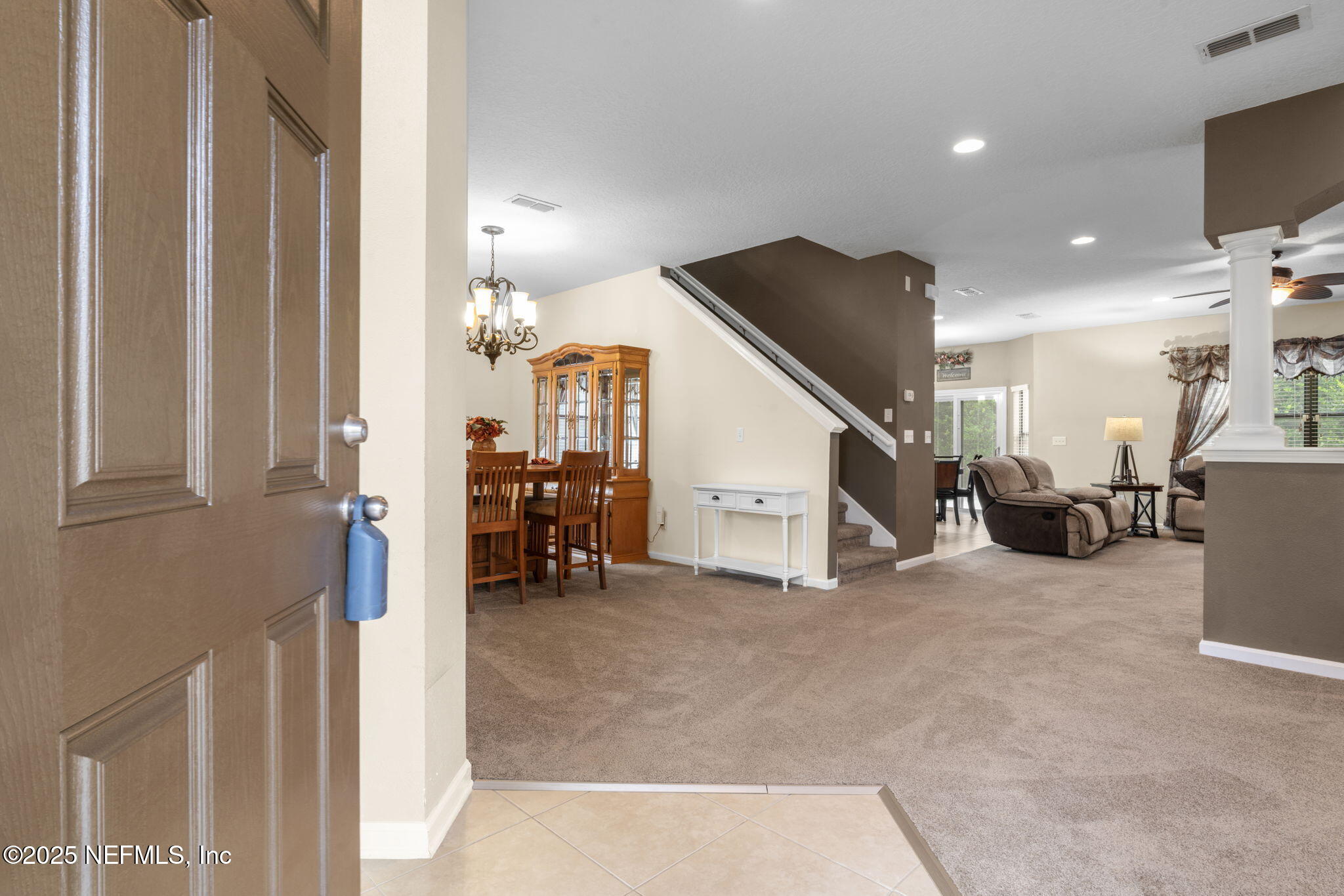 203 Buck Run Way St. Augustine, FL 32092 - Photo 8 of 62 a view of a livingroom with furniture and a hallway