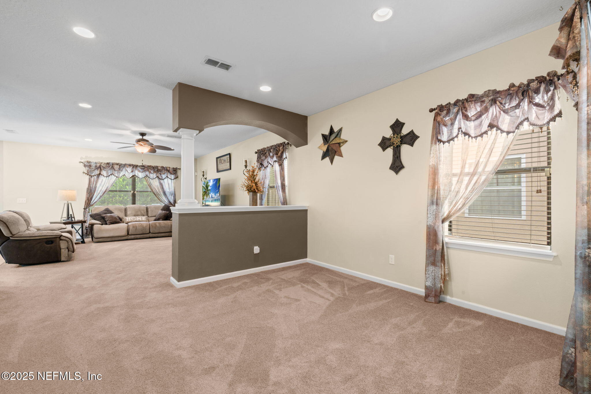 203 Buck Run Way St. Augustine, FL 32092 - Photo 9 of 62 a view of a livingroom with furniture and a ceiling fan