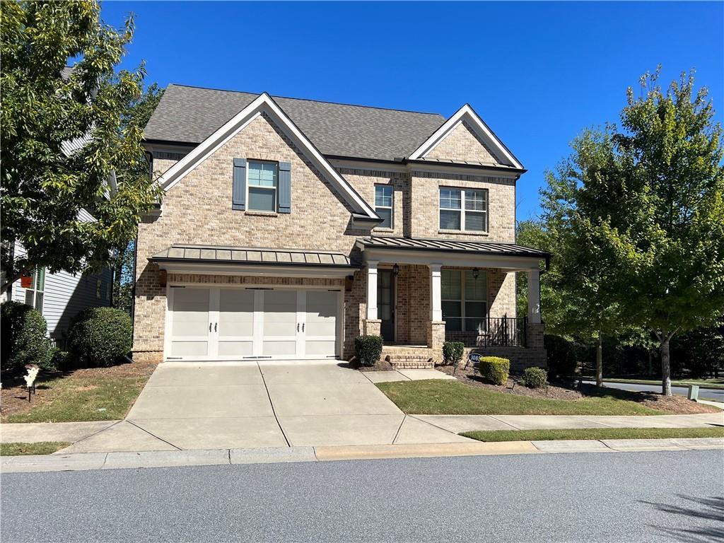 1085 Sutton Gln Way Alpharetta, GA 30004 - Photo 1 of 1 a front view of a house with a yard and trees