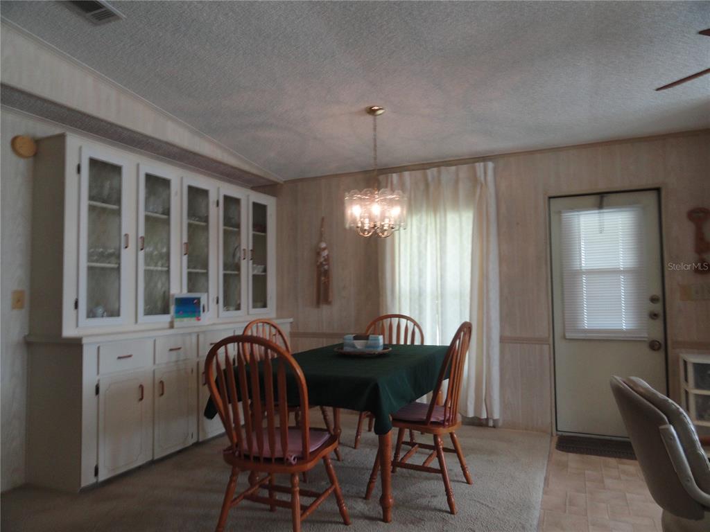 6233 Parakeet Road Englewood, FL 34224 - Photo 11 of 27 a view of a dining room with furniture window and outside view