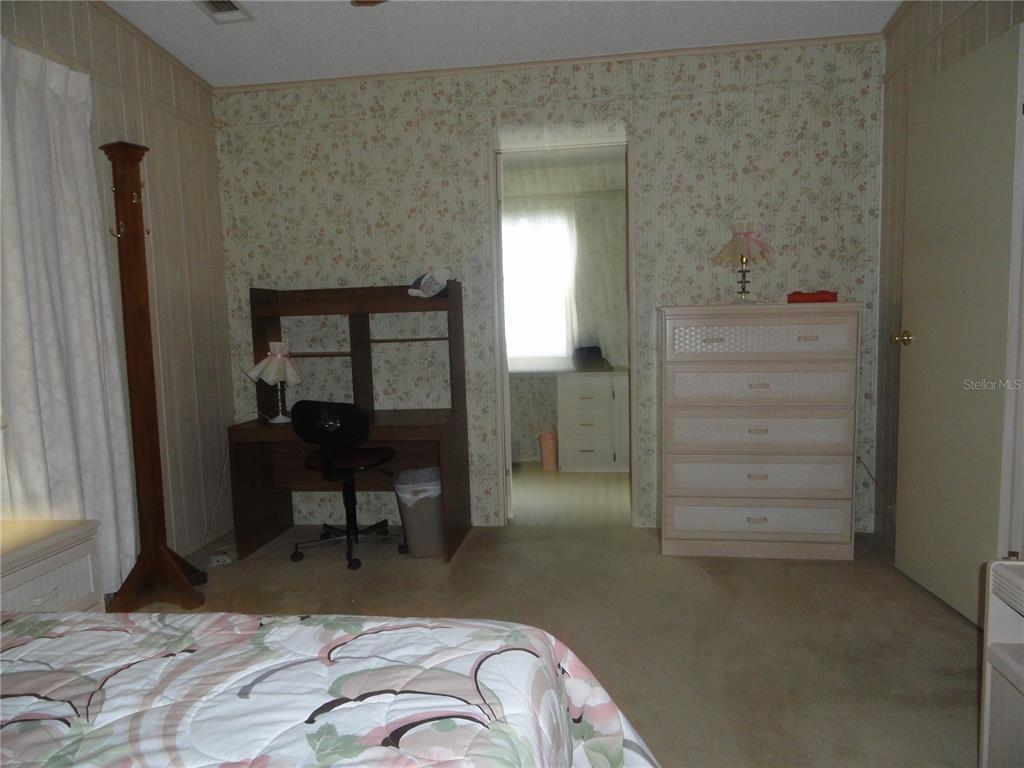 6233 Parakeet Road Englewood, FL 34224 - Photo 19 of 27 a view of a livingroom with furniture and front door