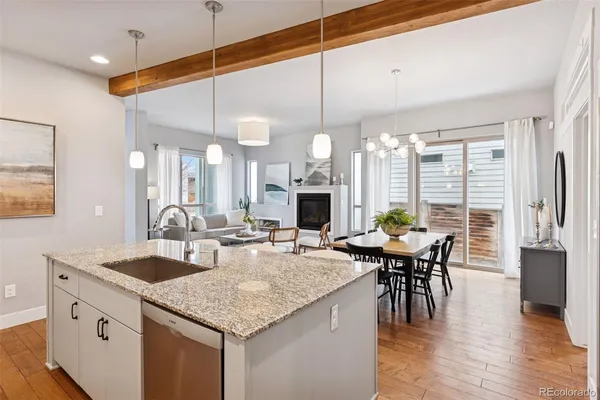 a kitchen with center island table and chairs