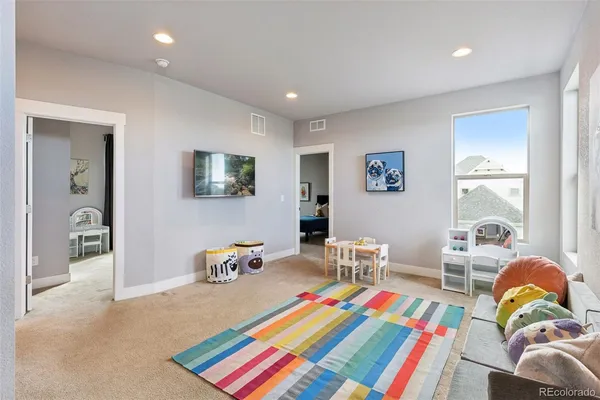 a living room filled with furniture and furniture