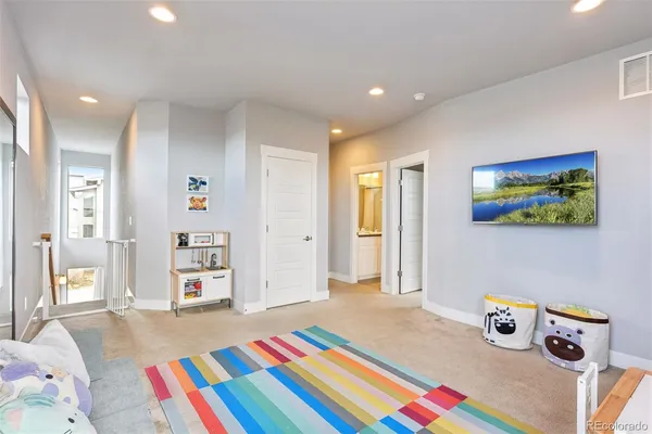 a bedroom with bed and a book shelf