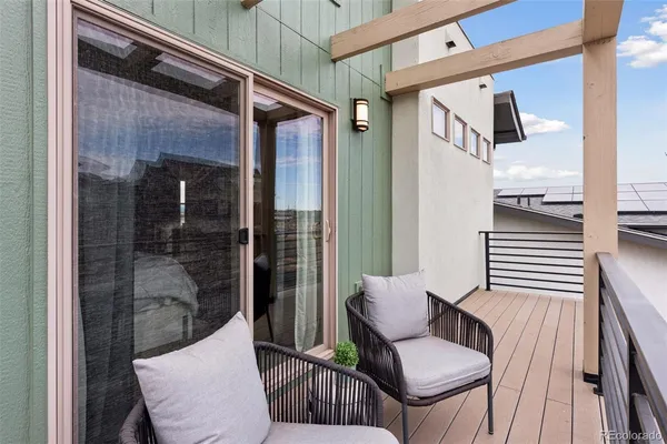 a view of a balcony with furniture