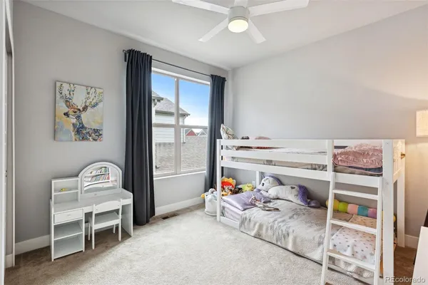 a bedroom with furniture and a window