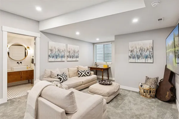 a spacious bedroom with a bed and glass walk in closet