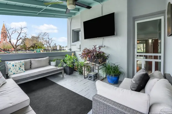 a living room with furniture and a flat screen tv