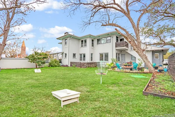 a aerial view of a house with a yard