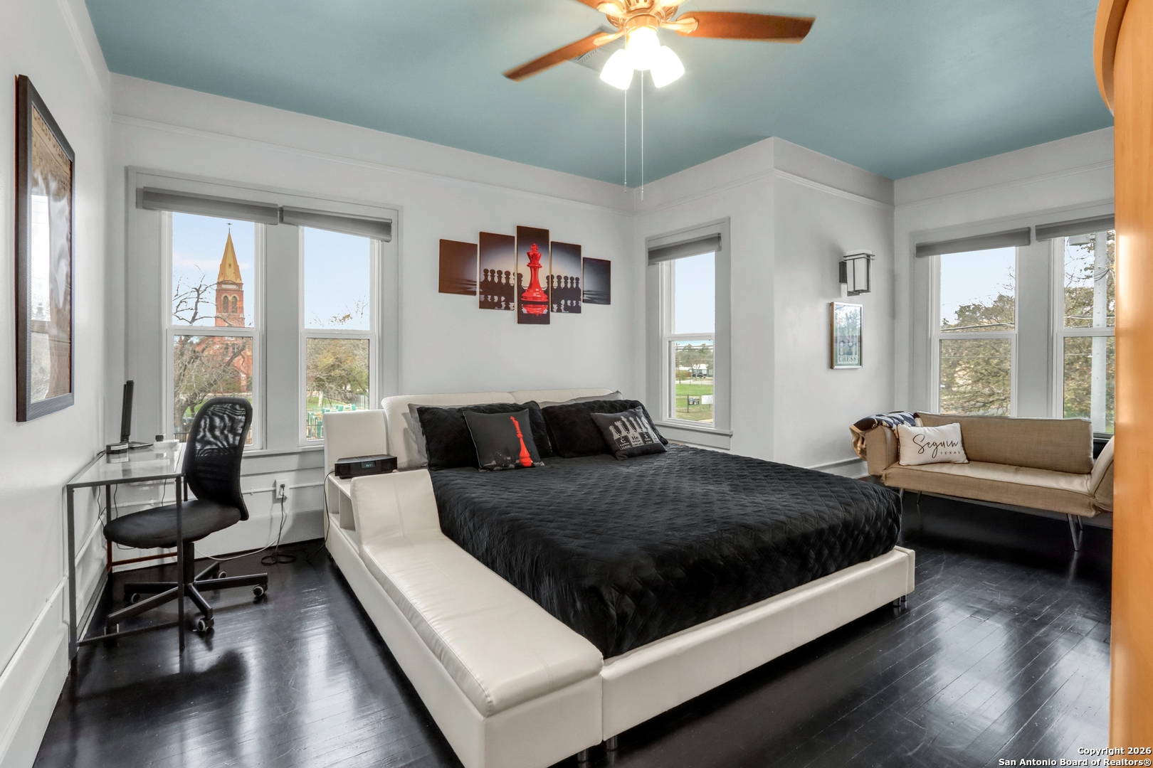 503 South Austin Street Seguin, TX 78155 - Photo 29 of 40 a bedroom with a bed and a couch