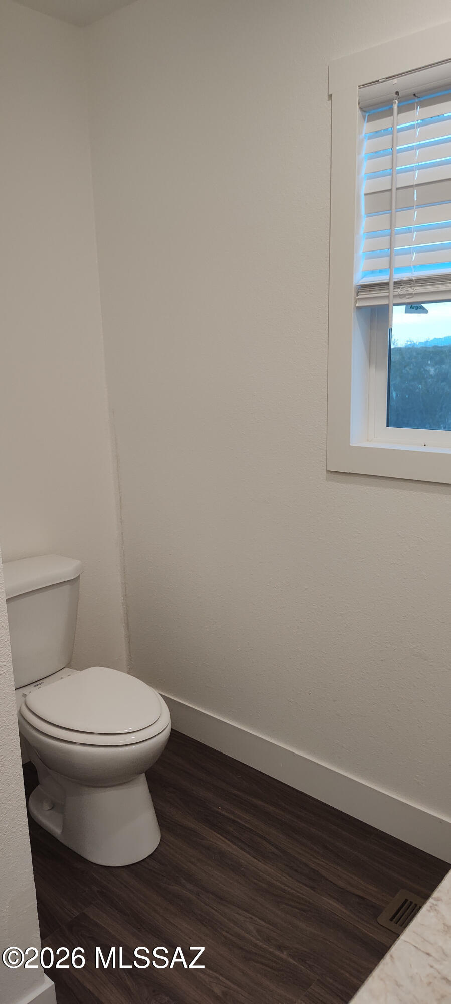 18565 West McClean Road Marana, AZ 85653 - Photo 30 of 37 a bathroom with a toilet and a window