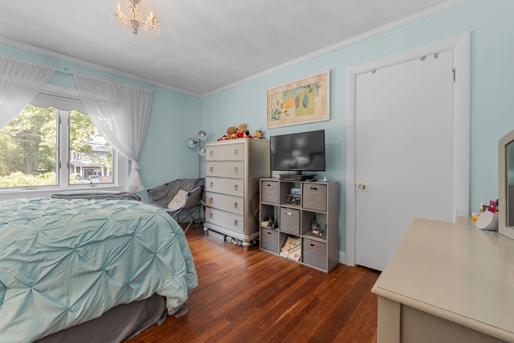 8 Mary Mt Road Auburndale, MA 02466 - Photo 27 of 36 a bedroom with a bed and a wooden floor