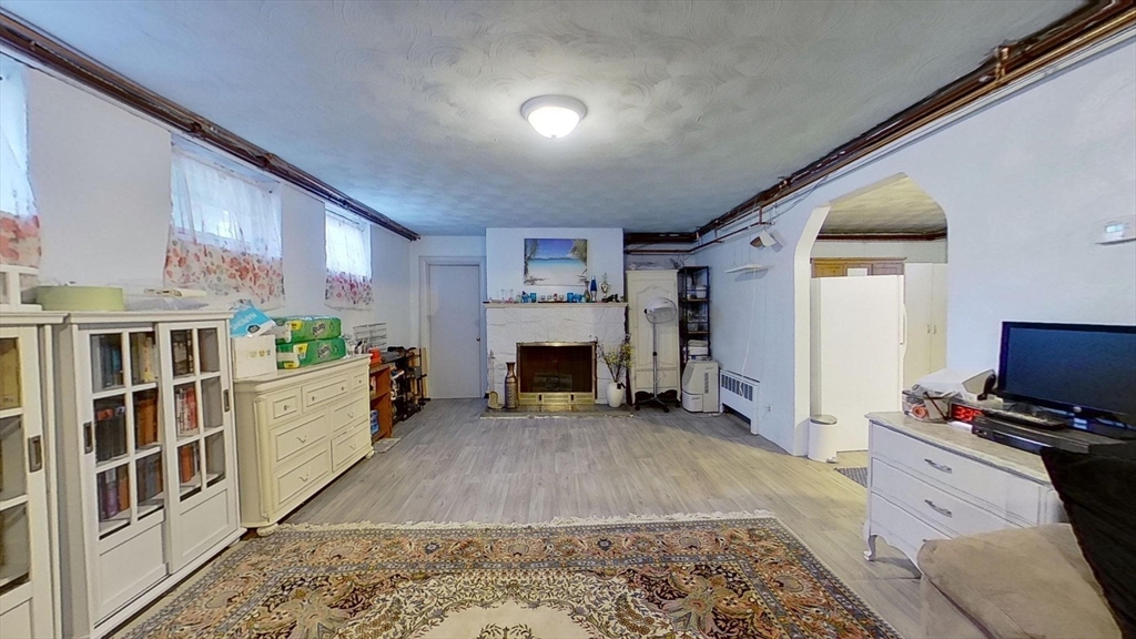 8 Mary Mt Road Auburndale, MA 02466 - Photo 31 of 36 a room with furniture and a fireplace
