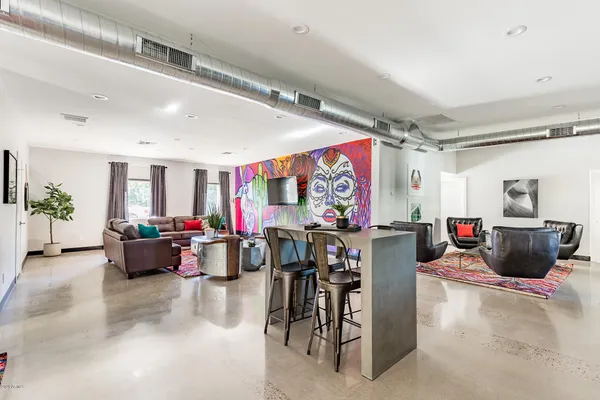 a living room with lots of furniture and couch