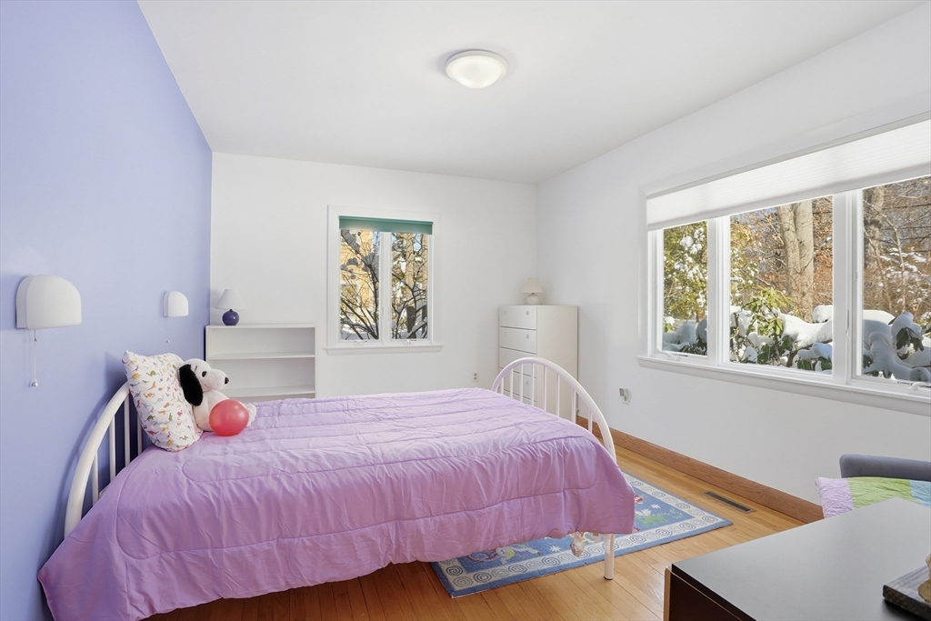 17 North Street Lexington, MA 02420 - Photo 22 of 42 a bedroom with a bed and a large window