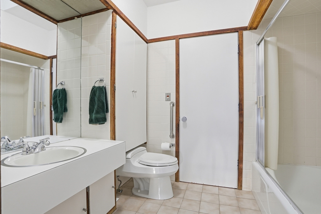17 North Street Lexington, MA 02420 - Photo 25 of 42 a bathroom with a double vanity sink toilet and shower