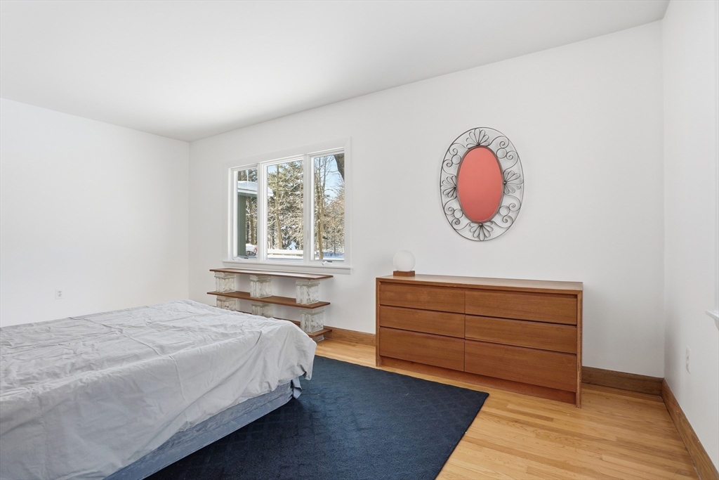 17 North Street Lexington, MA 02420 - Photo 27 of 42 a bedroom with a bed and a window