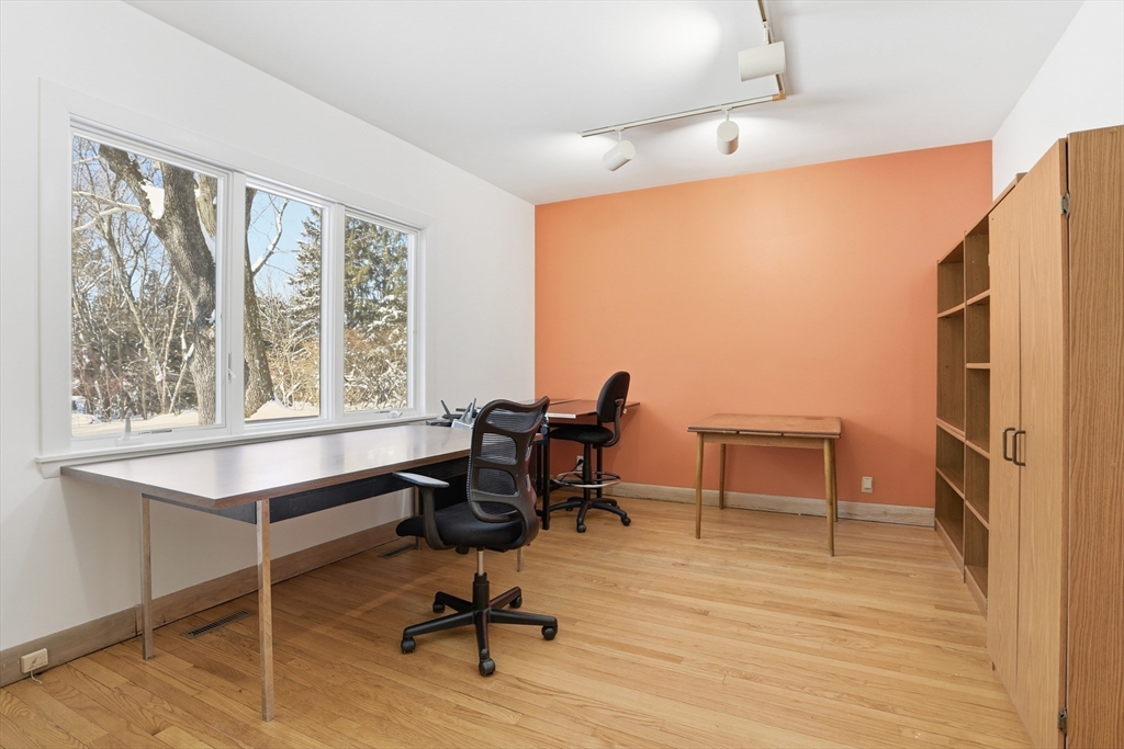 17 North Street Lexington, MA 02420 - Photo 28 of 42 a view of a workspace with furniture and a window