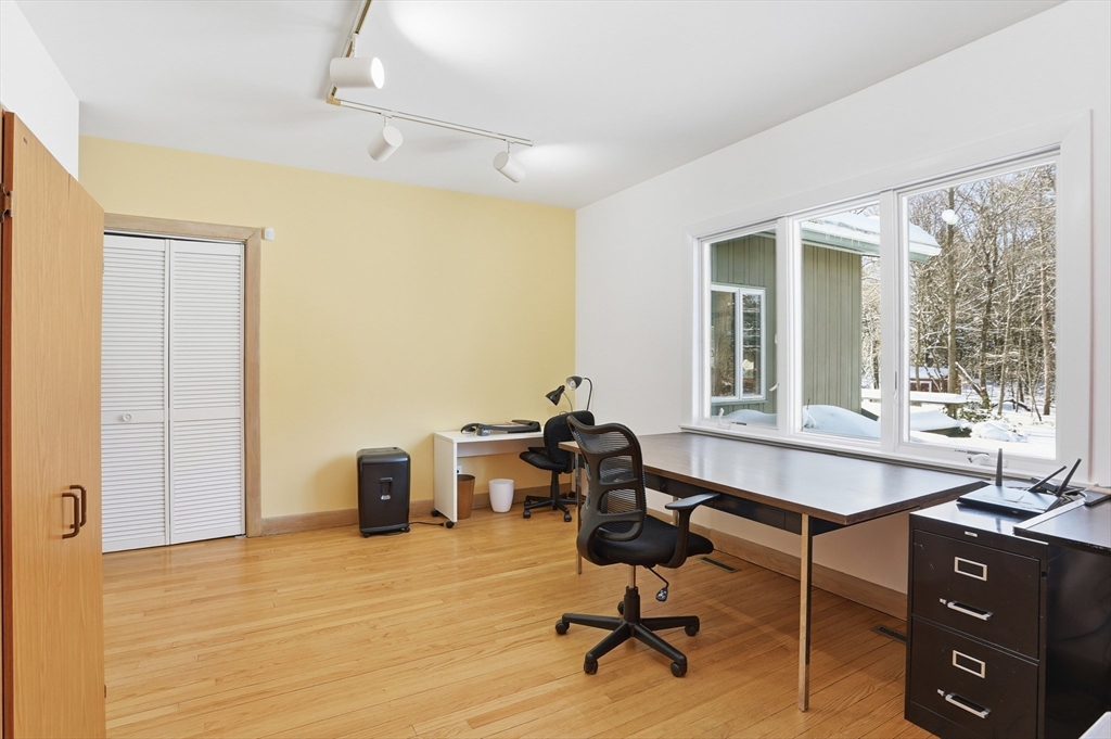 17 North Street Lexington, MA 02420 - Photo 29 of 42 a view of a workspace with furniture and a window