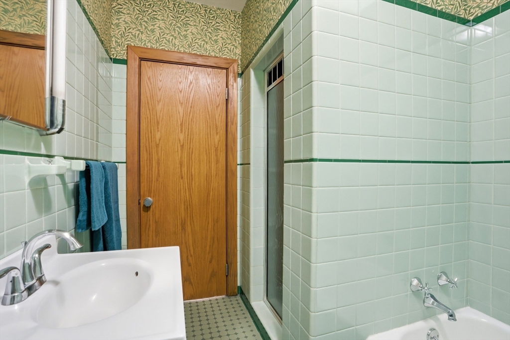 17 North Street Lexington, MA 02420 - Photo 31 of 42 a bathroom with a sink and a shower
