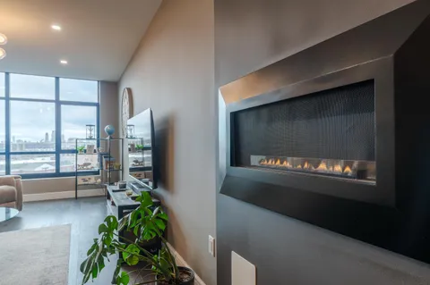 a bedroom with a bed and large mirror